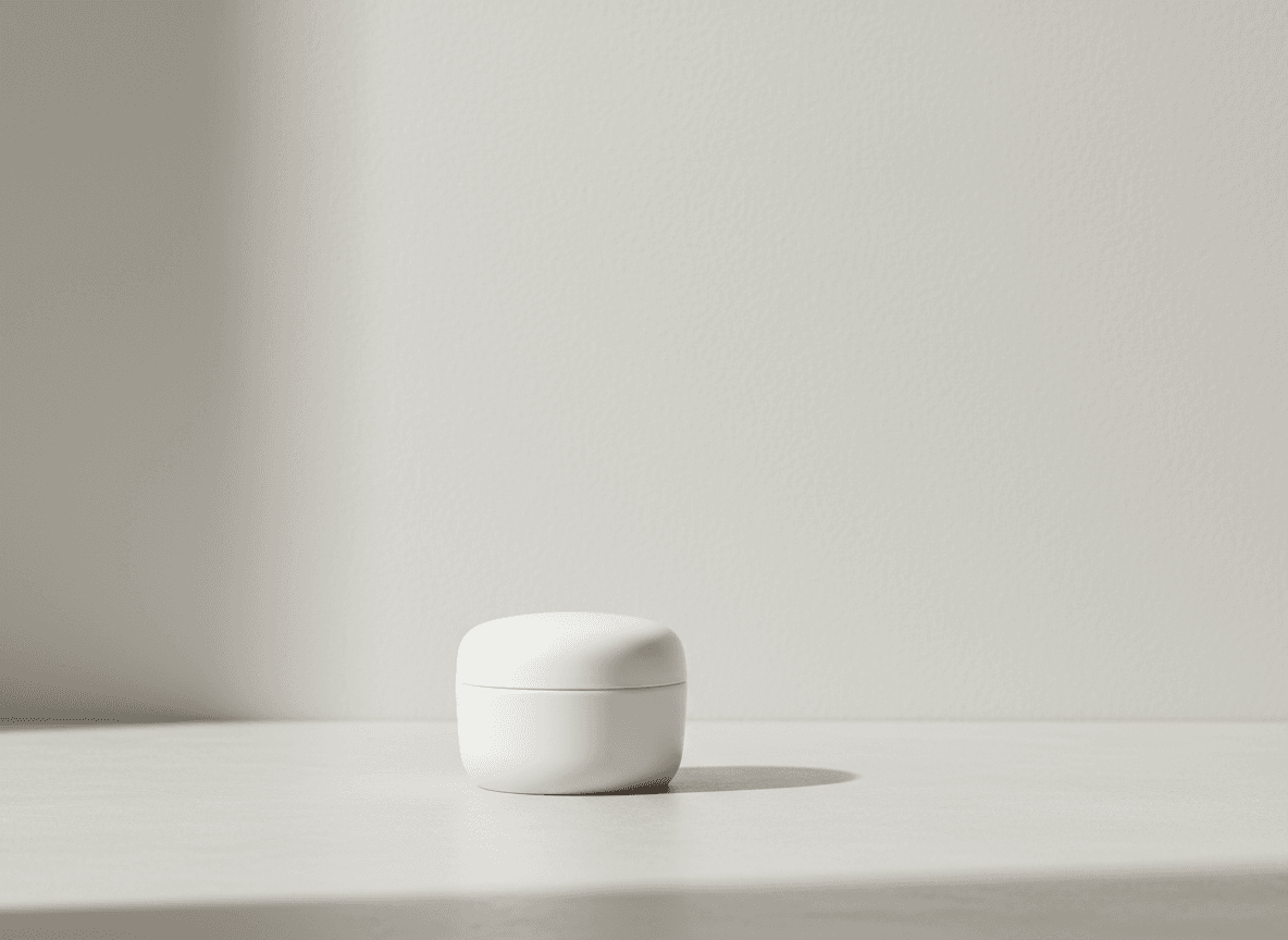 A minimal skincare surface with quiet daylight and generous negative space, built for a privacy page without decorative prop noise.